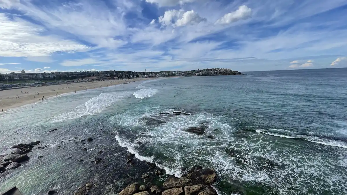 Bondi Beach from the headland, with surf and the bay